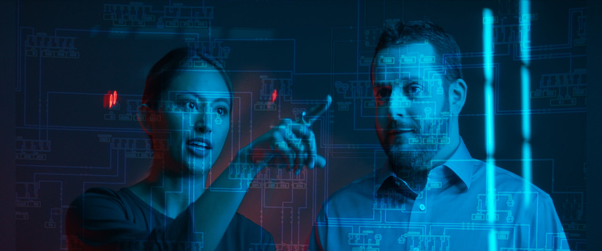 Two coworkers looking at data