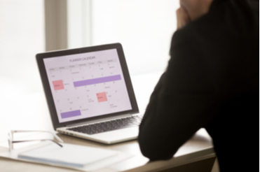 14840_17626_Self-scheduling A c omputer open with a calendar on it