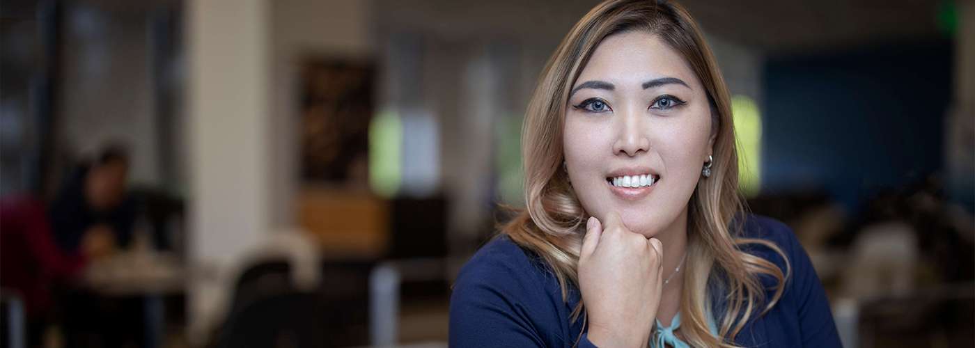 14840_16037_one_stop_banner A woman smiling