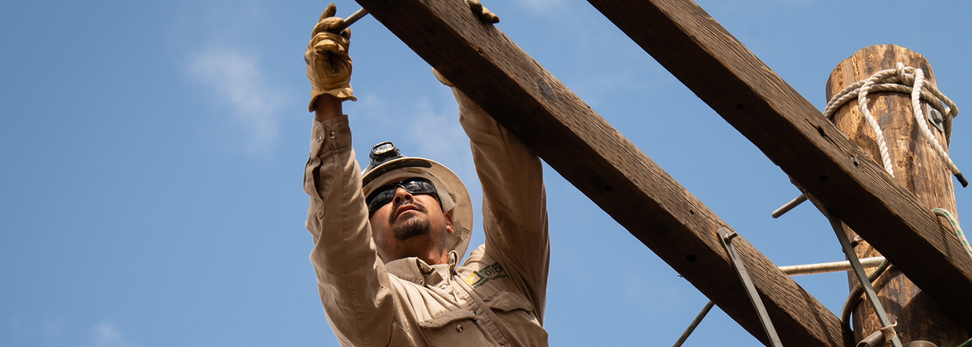 Shot of a lineman worker at work