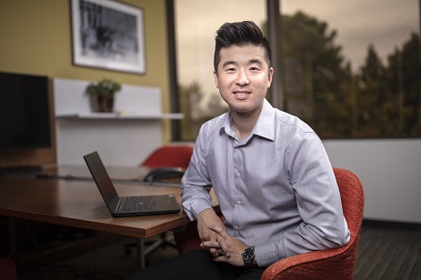 man sitting in an office facing at the camera