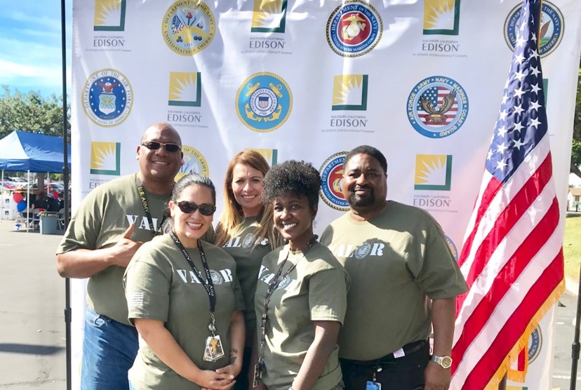 A group of military individuals in their uniform looking at the camera