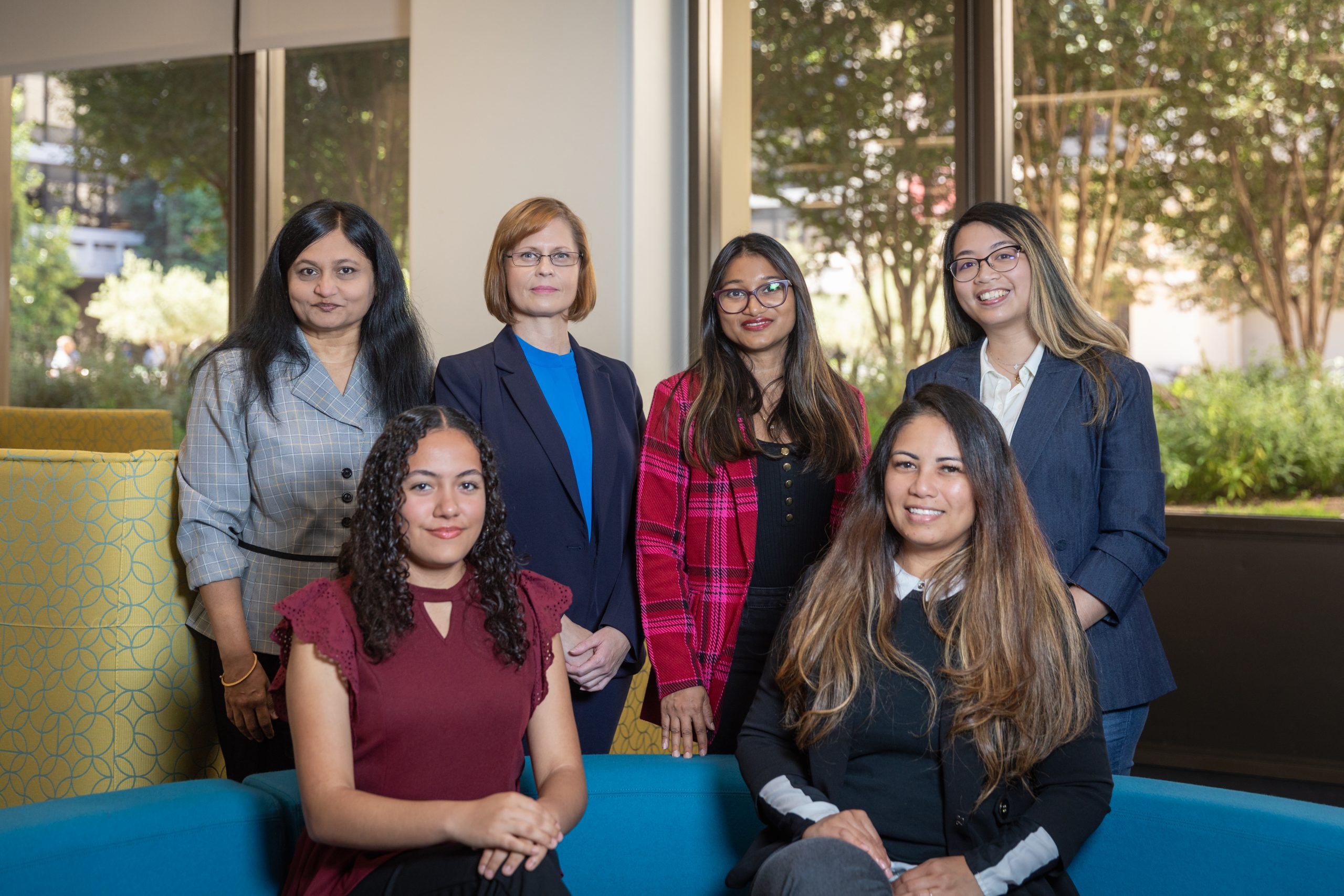 Group of women sitting together in a shared office space