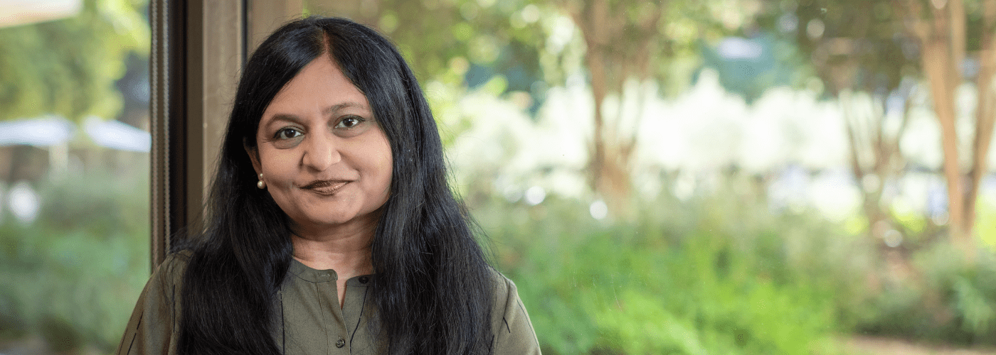 EdisonCareers.com Header Images Woman smiling at the camera with greenery behind