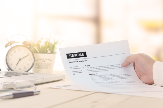 Someone holding a resume