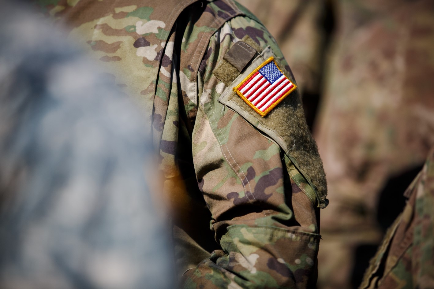 Military uniform close up image showing the Unitated States embroidered flag